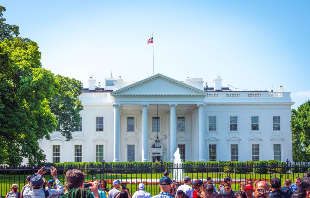 Photo of the White House with people on front